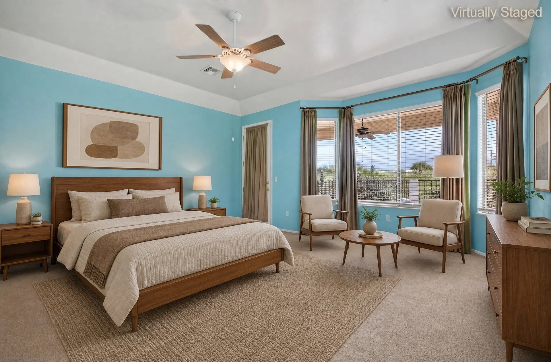 Virtually staged primary bedroom with high ceilings, ceiling fan and windows to the patio