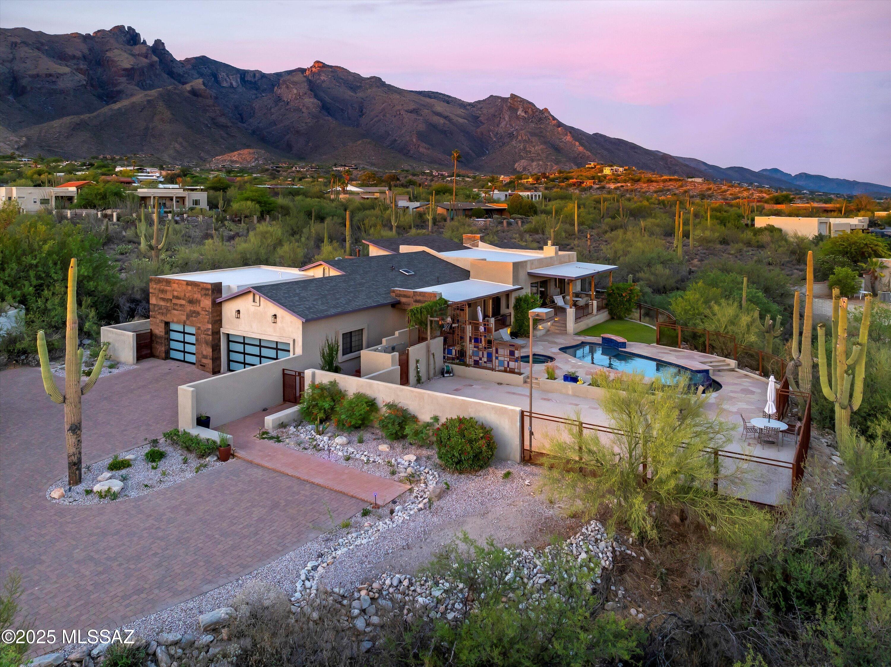 6836 N Green Mountain Place in the Catalina Foothills at twilight, below the Santa Catalina Mountains